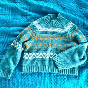 A turtle neck crop sweater